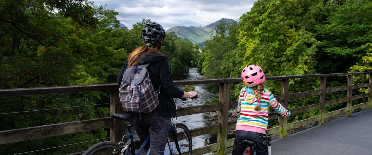 Mother and child cycling the Keswick to Threlkeld Railway Trail